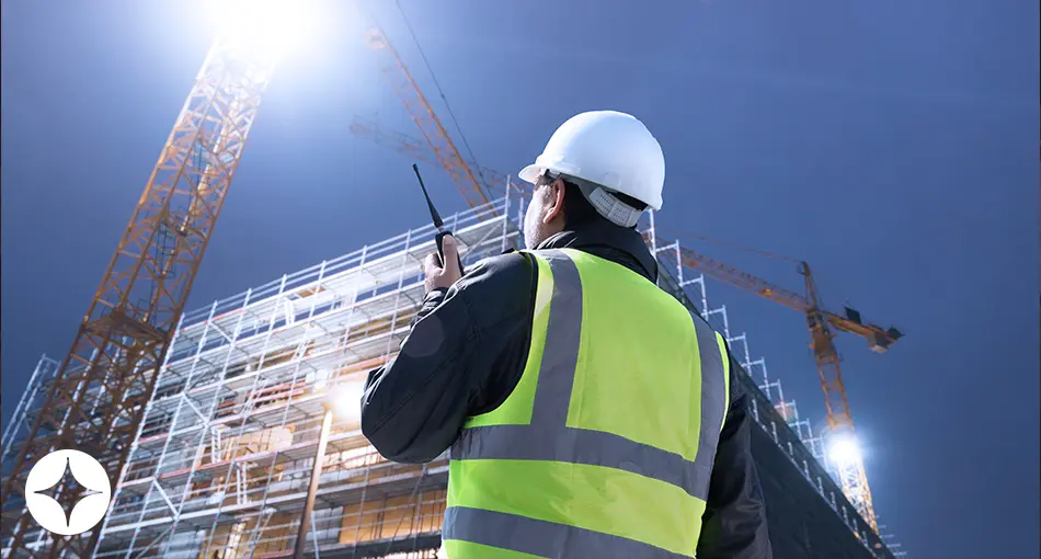 A construction worker working at night.