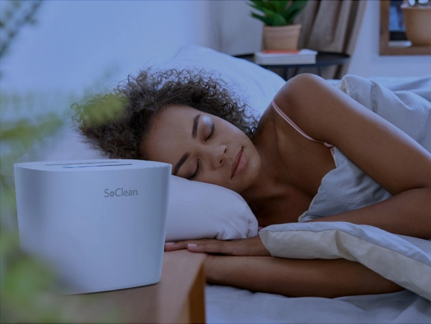 Woman Sleeping with a SoClean 3 on her Sleep Equipment Nightstand
