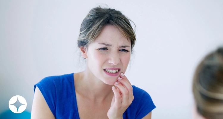 A woman in pain from grinding her teeth