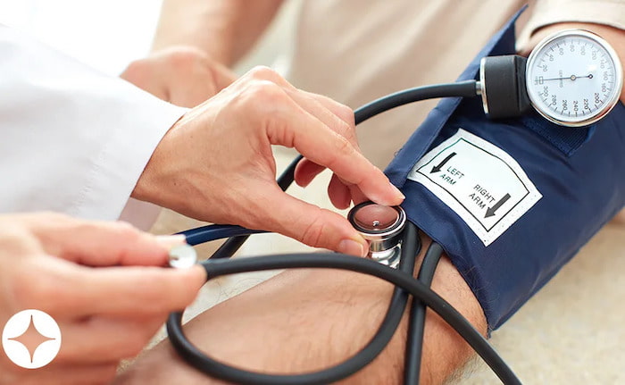 A patient getting their blood pressure measured.