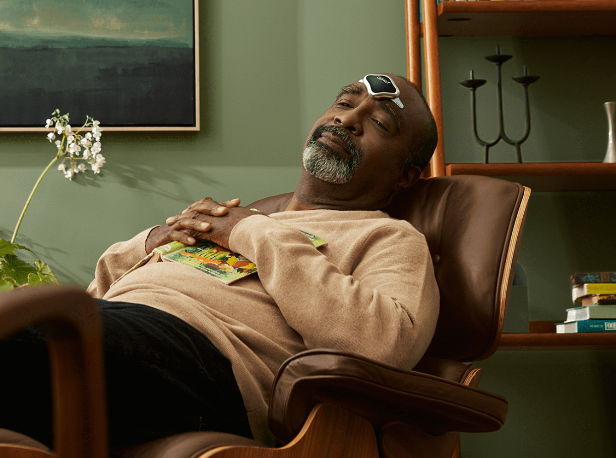 Man using Cefaly DUAL while relaxing
